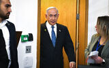 Prime Minister Benjamin Netanyahu enters a courtroom at the Tel Aviv District Court before the start of his testimony, December 23, 2024. (Reuven Kastro/POOL)