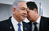 Prime Minister Benjamin Netanyahu consults with his defense lawyer Attorney Amit Hadad in a courtroom at the Tel Aviv District Court before the start of his testimony, December 23, 2024. (Reuven Kastro/POOL)