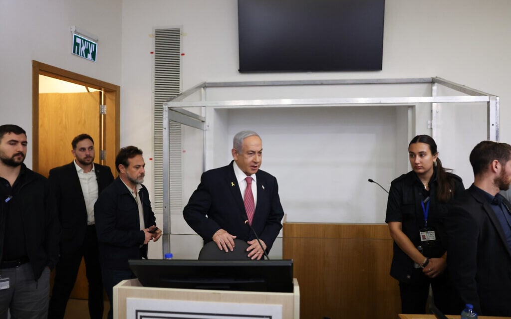 Prime Minister Benjamin Netanyahu arrives at the court room at the Tel Aviv District at the start of the sixth day of his testimony in the corruption trial against him, December 24, 2024. (Moti Milrod/POOL)