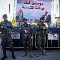 Members of the Palestinian security forces stand guard in the West Bank city of Hebron, December 24, 2024. (Wisam Hashlamoun/Flash90)