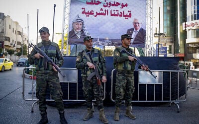 Members of the Palestinian security forces stand guard in the West Bank city of Hebron, December 24, 2024. (Wisam Hashlamoun/Flash90) Members of the Palestinian security forces stand guard in the West Bank city of Hebron, December 24, 2024. (Wisam Hashlamoun/Flash90)