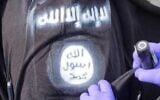 Illustrative: A symbol for the Islamic State terror group on a shirt worn by a terrorist who attacked security forces at the Qalandiya checkpoint, in the West Bank, December 7, 2024. (Israel Police/ File)