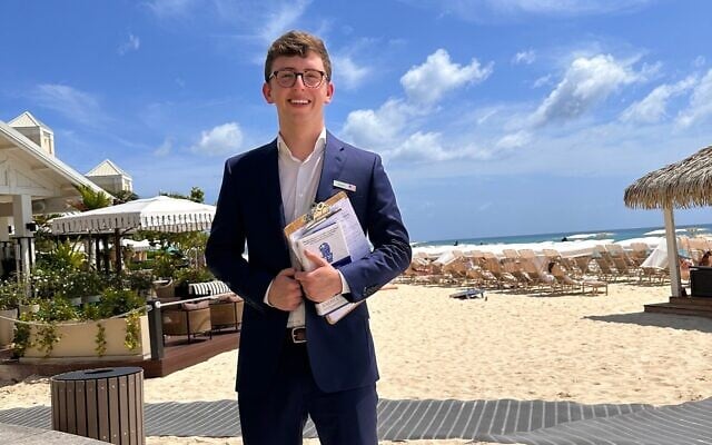 Isaac R. Ohrenstein on one of several international internship experiences, on Seven Mile Beach in the Cayman Islands at the Ritz Carlton Hotel. (Courtesy)