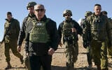 Prime Minister Benjamin Netanyahu visits the top of the Syrian side of Mount Hermon along with IDF Chief of Staff Herzi Halevi (right) and other troops, December 17, 2024. (Maayan Toaf/GPO)