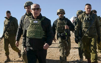 Prime Minister Benjamin Netanyahu visits the top of the Syrian side of Mount Hermon along with IDF Chief of Staff Herzi Halevi (right) and other troops, December 17, 2024. (Maayan Toaf/GPO)