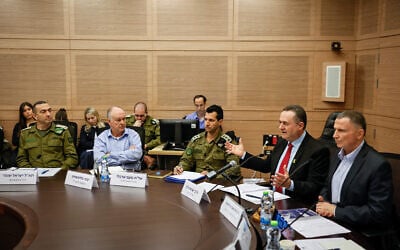 Chairman Yuli Edelstein, right, and Defense Minister Israel Katz, second from right, during a closed meeting of the Knesset Foreign Affairs and Defense Committee, December 16, 2024. (Noam Moskowitz, Office of the Knesset Spokesperson)