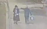 A man yanks at the sidecurls of an ultra-Orthodox passerby in Jerusalem, December 4, 2024. (Screen capture via X, used in accordance with Clause 27a of the Copyright Law)
