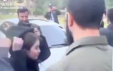 Lea Kheirallah covers her hair upon request from Ahmed al-Sharaa (facing away) during the de facto Syrian leader's visit tour in Damascus's Messeh area on December 10, 2024. (X screenshot used in accordance with article 27a of the copyright law)