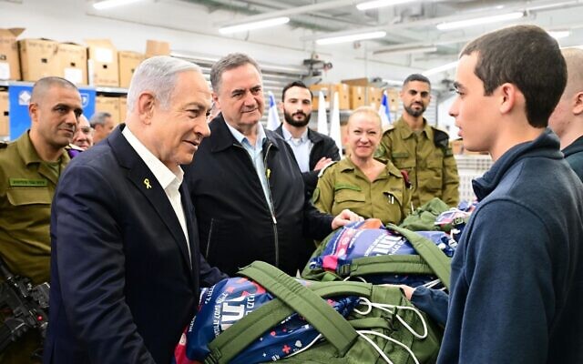 Prime Minister Benjamin Netanyahu speaks to new recruits at the IDF induction center at Tel Hashomer, December 1, 2024. (Amos Ben Gershom/GPO) Prime Minister Benjamin Netanyahu speaks to new recruits at the IDF induction center at Tel Hashomer, December 1, 2024. (Amos Ben Gershom/GPO)