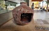 Byzantine-era clay lantern discovered at Tzippori National Park, in an image released on December 22, 2024. (Daniel Hittner/National Parks Authority)