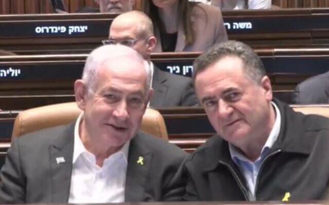 Prime Minister Benjamin Netanyahu (l) sits next to Defense Minister Israel Katz after leaving hospital for a budget vote in the Knesset in Jerusalem on December 31, 2024 (Screencapture/Knesset TV) Prime Minister Benjamin Netanyahu (l) sits next to Defense Minister Israel Katz after leaving hospital for a budget vote in the Knesset in Jerusalem on December 31, 2024 (Screencapture/Knesset TV)