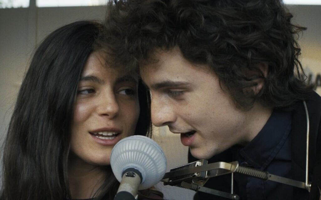 Timothée Chalamet and Monica Barbaro in a scene from "A Complete Unknown." (Macall Polay/Searchlight Pictures via AP).