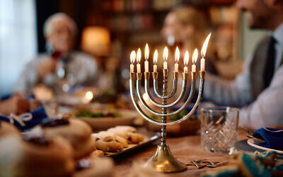 Illustrative: A family celebrates Hanukkah. (Drazen Zigic/iStock Images)