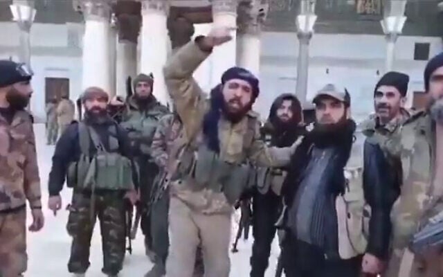 Islamist rebels make a statement from a mosque in Damascus, warning that they are "coming for Jerusalem," in footage circulating on social media on December 8, 2024. (Screenshot, used in accordance with Clause 27a of the Copyright Law)