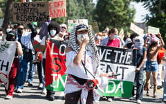 On the anniversary of the October 7, 2023, Hamas onslaught, anti-Israel, pro-Palestinian protesters march in support of the Boycott, Divestment and Sanctions movement against Israel, on the Los Angeles campus of the University of Southern California, October 7, 2024 in Los Angeles. (Sarah Reingewirtz, Los Angeles Daily News/SCNG, via JTA)