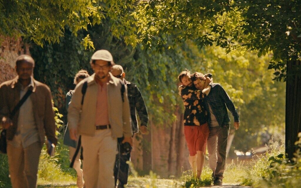 Benji (Kieran Culkin) and David Kaplan (Jesse Eisenberg) are seen at far right in a scene from 'A Real Pain,' directed and written by Eisenberg. (Courtesy Searchlight Pictures via JTA)