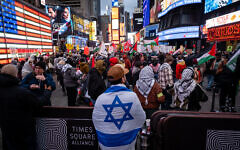 A pro-Israel counter-protester at an anti-Israel demonstration in Times Square, New York City, January 1, 2025. (Luke Tress/Times of Israel)