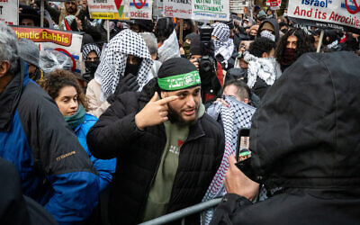 A man in a Hamas headband at an anti-Israel protest in New York City, January 6, 2025. (Luke Tress/Times of Israel)