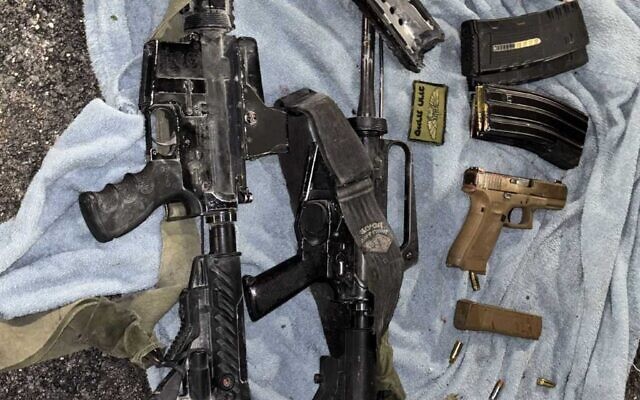 Weapons belonging to two Palestinian gunmen who killed an Israeli soldier, uncovered by IDF troops in an overnight raid in the Jenin refugee camp in the West Bank, in a photo cleared for publication on January 31, 2025. (Israel Defense Forces)