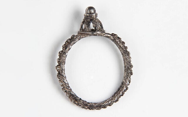 During the 2018 season excavation at the Huqoq synagogue in North Israel, archaeologists uncovered a hoard of medieval coins and jewelry, including an architectural silver ring likely made between the 6th and 8th centuries in Western Europe. (Jim Haberman)