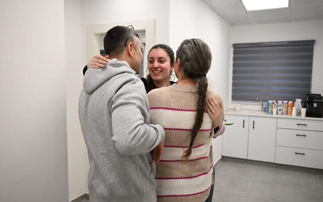 Released hostage Karina Ariev is seen with her parents after being freed from Hamas captivity on January 25, 2025 (Israel Defense Forces)