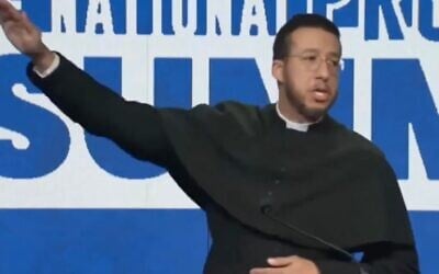 Father Calvin Robinson gives Elon Musk's salute at the National Pro-Life Summit, January 25, 2025, in Washington. (X screenshot, used in accordance with Clause 27a of the Copyright Law)