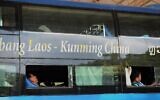 Illustrative: Tourists rest on an overnight 'sleeper' bus to Laos, March 11, 2011. (Hoang Dinh Nam / AFP)
