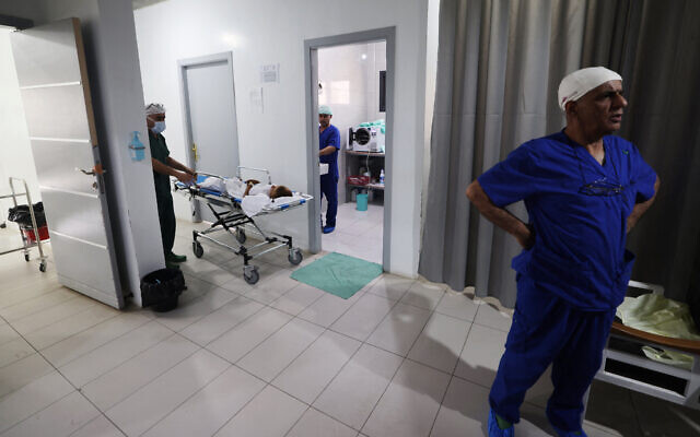 Medics care for patients at a clinic set up by Doctors Without Borders (MSF) treating severe injuries and burns sustained in Israeli bombardment, at the Rafah Indonesian Field Hospital in Rafah in the southern Gaza Strip on April 24. (Mohammed Abed/AFP)