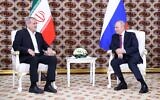 Iran's President Masoud Pezeshkian, left, meets with Russian President Vladimir Putin on the sidelines of an international forum in Ashgabat, Turkmenistan, October 11, 2024. (Alexander Shcherbak / Pool / AFP)