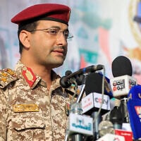 Brigadier Yahya Saree Qasim, spokesman for Yemen's Houthi group, speaks during a rally denouncing Israel in Sanaa on January 3, 2025.(Photo by Mohammed HUWAIS / AFP)