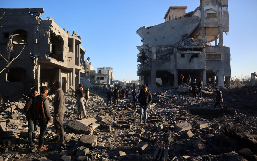 Palestinians check the destruction in the aftermath of an Israeli strike in the al-Maghazi camp in the central Gaza Strip on January 3, 2025.(Eyad Baba/AFP)