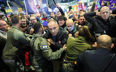 Police clash with protesters during a demonstration calling for the release of hostages held captive in Gaza in Tel Aviv on January 4, 2025. (Jack Guez / AFP)