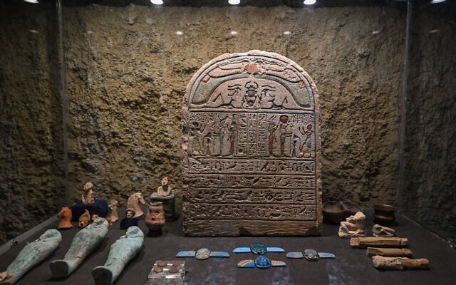 A display showcases a stele and multiple artifacts during a media event to announce new discoveries by an Egyptian archaeological mission at Queen Hatshepsut's Valley Temple in Deir El-Bahari on the Nile's west bank in Luxor on January 8, 2025. (Khaled Desouk/AFP) A display showcases a stele and multiple artifacts during a media event to announce new discoveries by an Egyptian archaeological mission at Queen Hatshepsut's Valley Temple in Deir El-Bahari on the Nile's west bank in Luxor on January 8, 2025. (Khaled Desouk/AFP)