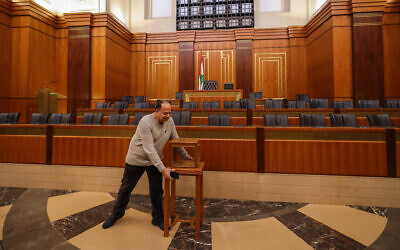Members of staff prepare the main chamber of the Parliament and set up a ballot box, a day ahead of a parliamentary session to elect a president in Beirut on January 8, 2025. (Anwar Amro/AFP)