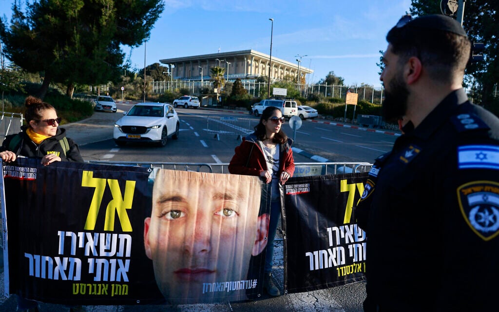 Relatives and supporters of Israelis held hostage in Gaza since October 2023 stage a protest calling for a deal with the Palestinian Hamas group to secure their release, in front of the Knesset in Jerusalem on January 14, 2025. (Menahem Kahana / AFP)