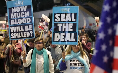 Demonstrators raise placards during a protest calling for action to secure the release of Israelis held hostage in Gaza since the October 2023, in Tel Aviv on January 14, 2025. (Jack GUEZ / AFP)