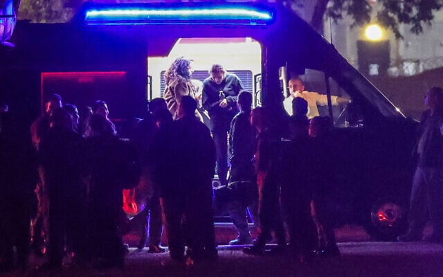 The three released Israeli hostages exit a van before boarding an Israeli Air Force military transport helicopter near Reim in southern Israel on January 19, 2025 (Photo by GIL COHEN-MAGEN / AFP)