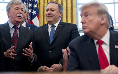 In this February 7, 2019 file photo, from left, National Security Adviser John Bolton, accompanied by Secretary of State Mike Pompeo, and US President Donald Trump, speaks before Trump signs a National Security Presidential Memorandum to launch the "Women's Global Development and Prosperity" Initiative in the Oval Office of the White House in Washington. (AP Photo/Andrew Harnik)