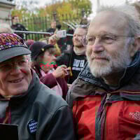 Jerry Greenfield (right) and Ben Cohen (left), co-founders of Ben & Jerry's ice cream, attend a protest in Washington on November 8, 2019. (AP Photo/Patrick Semansky, File)