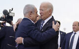 Then-US President Joe Biden, right, hugs Prime Minister Benjamin Netanyahu after arriving at Ben Gurion International Airport near Tel Aviv, October 18, 2023. (AP Photo/Evan Vucci)