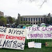 Signs are displayed outside a tent encampment at Northwestern University on April 26, 2024, in Evanston, Illinois. (AP/ Teresa Crawford/ File)