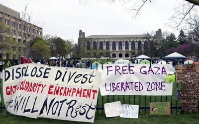 Signs are displayed outside a tent encampment at Northwestern University on April 26, 2024, in Evanston, Illinois. (AP/ Teresa Crawford/ File)