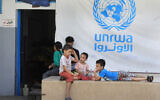 Palestinian children who fled with their parents from their houses in the Palestinian refugee camp of Ein el-Hilweh, gather in the backyard of an UNRWA school, in Sidon, Lebanon, September 12, 2023. (AP Photo/Mohammed Zaatari)
