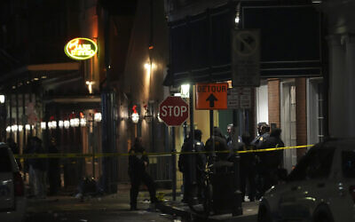 Emergency services attend the scene after a vehicle drove into a crowd on New Orleans' Canal and Bourbon Street, January 1, 2025. (AP Photo/Gerald Herbert)