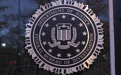 The seal of the Federal Bureau of Investigation (FBI) is seen on the Headquarters in Washington, Saturday, December 7, 2024. (AP/Jose Luis Magana, File)