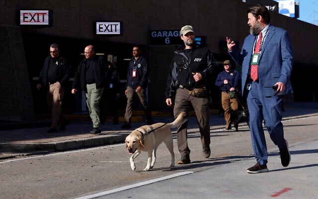 Security with bomb-sniffing dogs patrol the area around the Superdome ahead of the Sugar Bowl NCAA College Football Playoff game, in New Orleans, Louisiana, January 2, 2025. (AP Photo/Butch Dill) Security with bomb-sniffing dogs patrol the area around the Superdome ahead of the Sugar Bowl NCAA College Football Playoff game, in New Orleans, Louisiana, January 2, 2025. (AP Photo/Butch Dill)