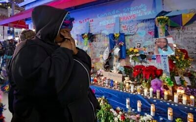 Courtney Polk, cousin of Tasha Polk, who was killed in the New Year's Day attack, reacts at a memorial on Bourbon Street and Canal Street in New Orleans, January 4, 2025, (AP Photo/Matthew Hinton)