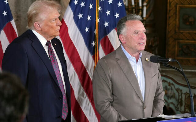 President-elect Donald Trump listens as Steve Witkoff speaks during a news conference at Mar-a-Lago, Tuesday, January 7, 2025, in Palm Beach, Fla. (AP Photo/Evan Vucci)