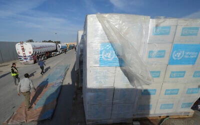 File: Trucks carrying UNRWA humanitarian aid line up to cross the Rafah border crossing between Egypt and the Gaza Strip, Sunday, Jan. 19, 2025. (AP Photo/Amr Nabil)