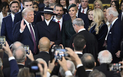 US President Donald Trump takes the oath of office during the 60th presidential inauguration, in the Rotunda of the US Capitol in Washington, January 20, 2025. (Saul Loeb/Pool photo via AP)